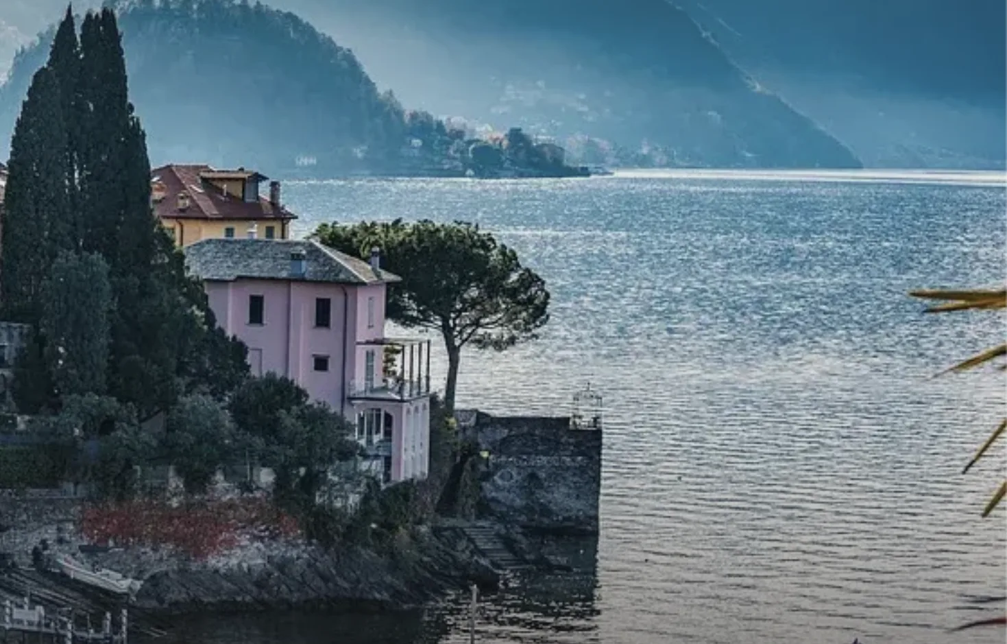 Pastel villas and cypresses above the water at Varenna, Lake Como, Italy