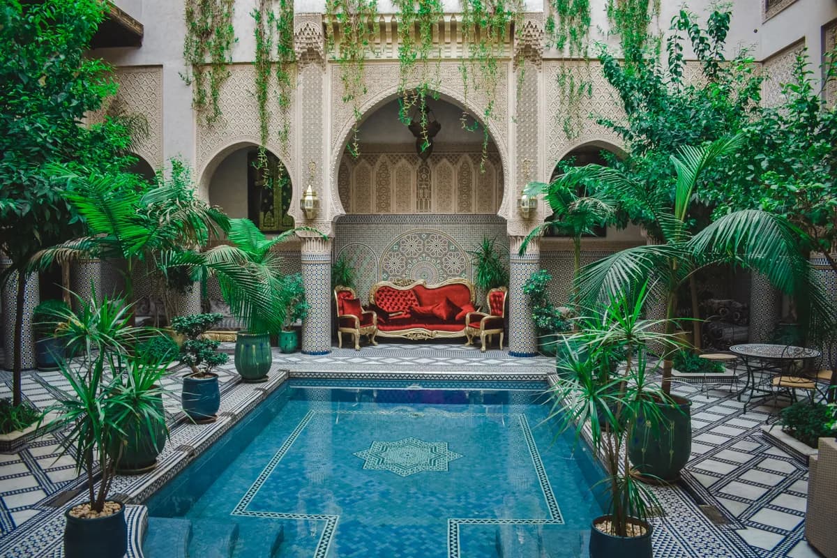 Editorial travel scenery — a quiet hotel courtyard pool