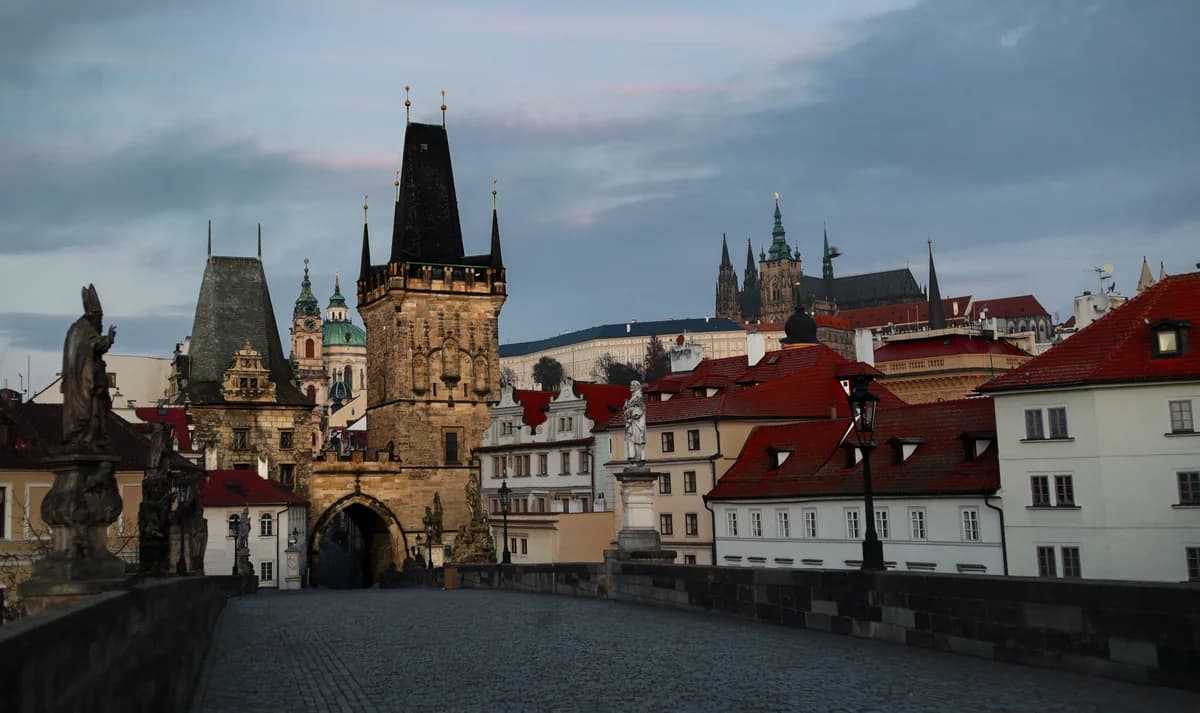 Explore the historic Charles Bridge and Prague's captivating skyline at dawn.
